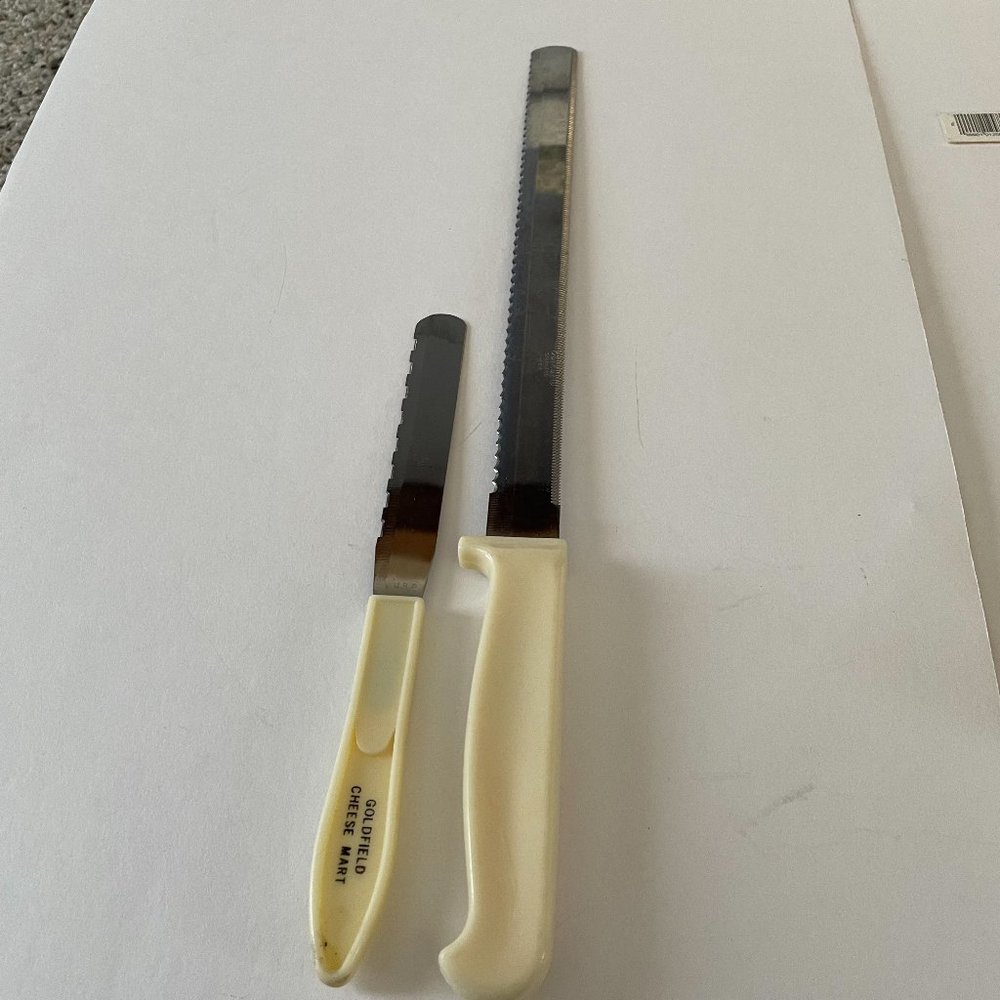 Quikut serrated knife 9" and 7 1/2" cheese knife marked Goldfield Cheese Mart